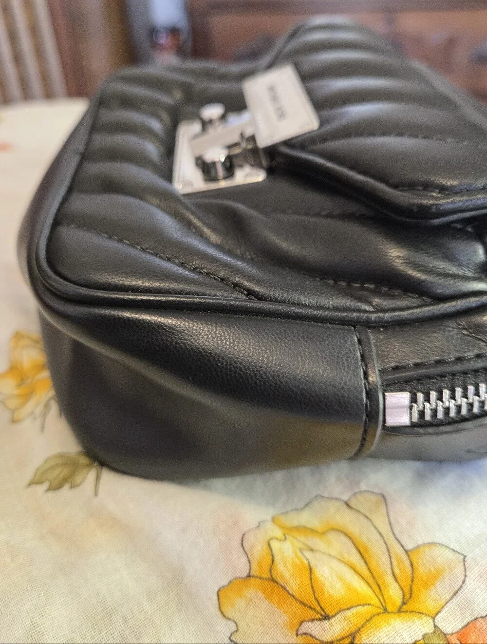 MICHAEL KORS Black Quilted Leather Crossbody with Silver Lock Closure